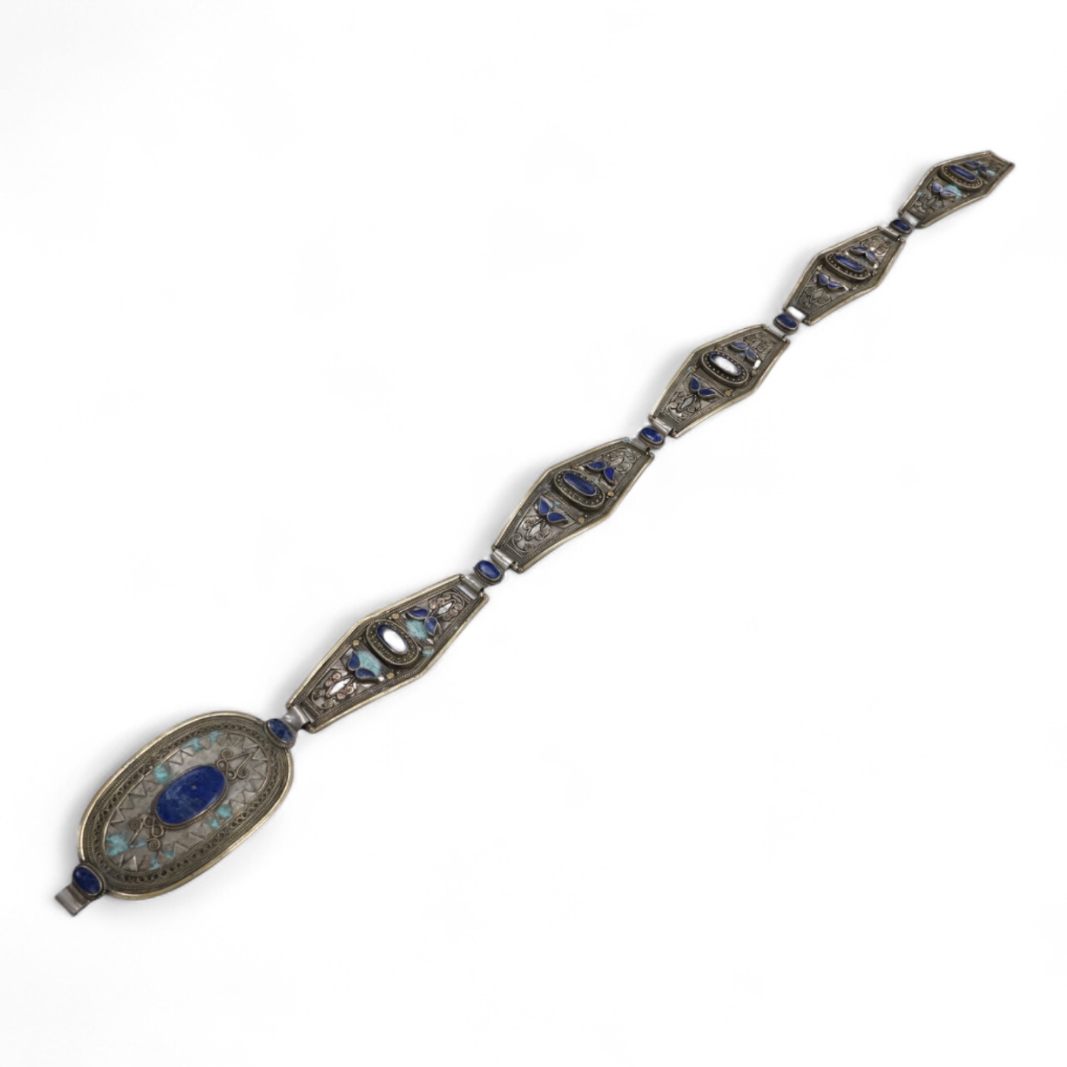 A lapis lazuli inset base metal panelled belt, possibly Afghan, 90cm in length